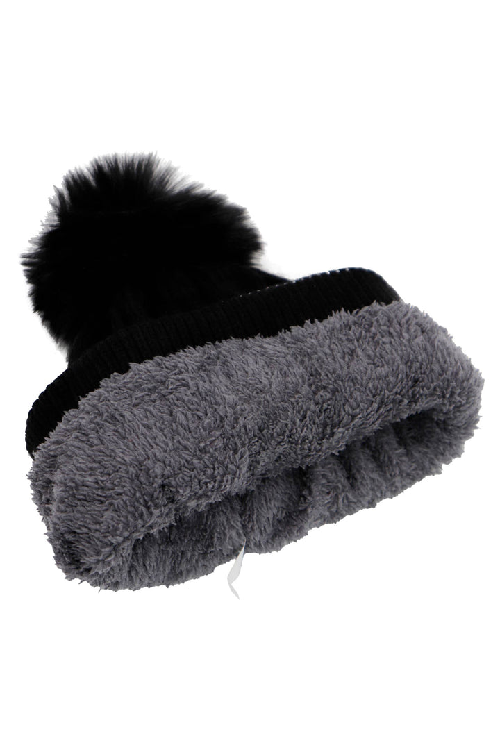 Gray knit beanie with black pom-pom on a white background