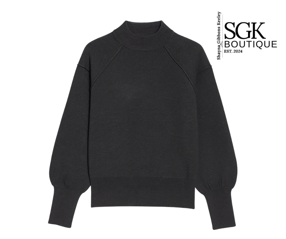Black sweater on a white background with SGK Boutique logo.