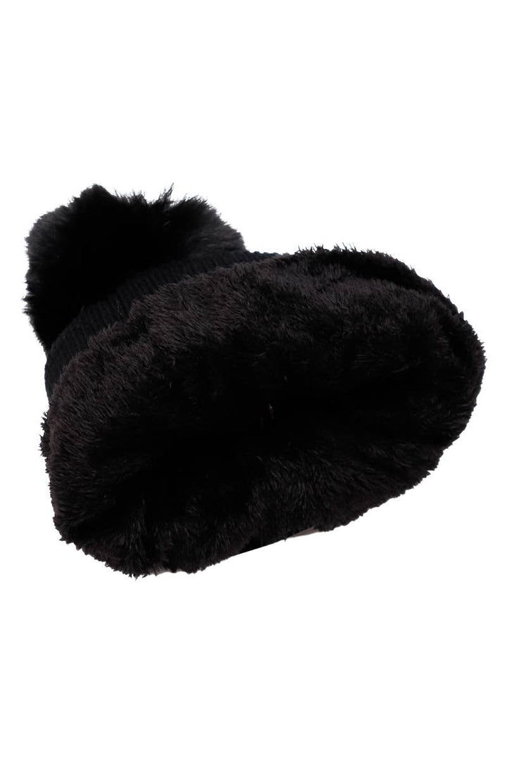 Black fuzzy slippers on a white background