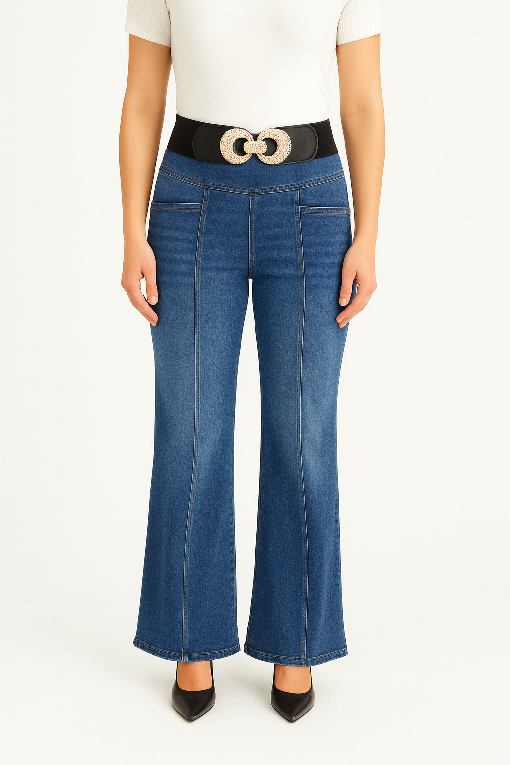 Person wearing blue flared jeans with a belt on a white background