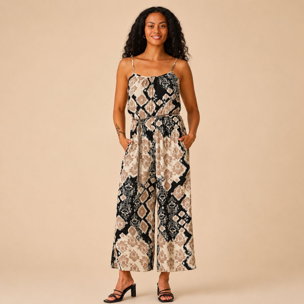 Woman wearing a patterned dress on a beige background