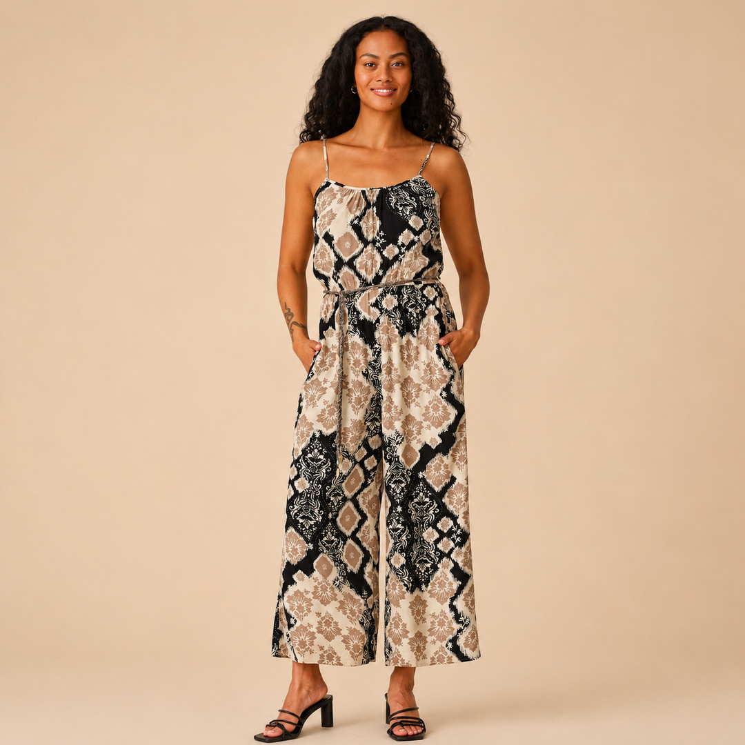 Woman wearing a patterned dress on a beige background