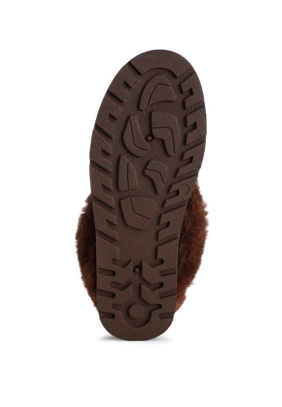 Brown boot sole with textured pattern on a white background