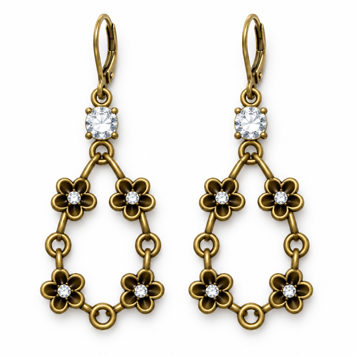 A pair of gold drop earrings with leverback hooks, featuring a square clear crystal at the top and three tiers of flower-shaped links, each accented with a small round clear crystal, shown on a plain white background.