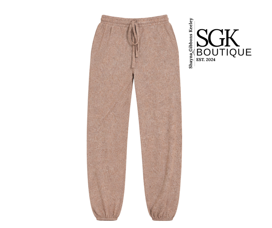Beige sweatpants on a white background with SGK Boutique branding.
