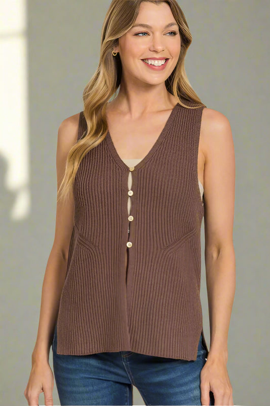 Woman wearing a brown sleeveless knitted top on a white background