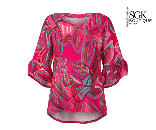 Pink floral patterned top with SGK Boutique branding on a white background