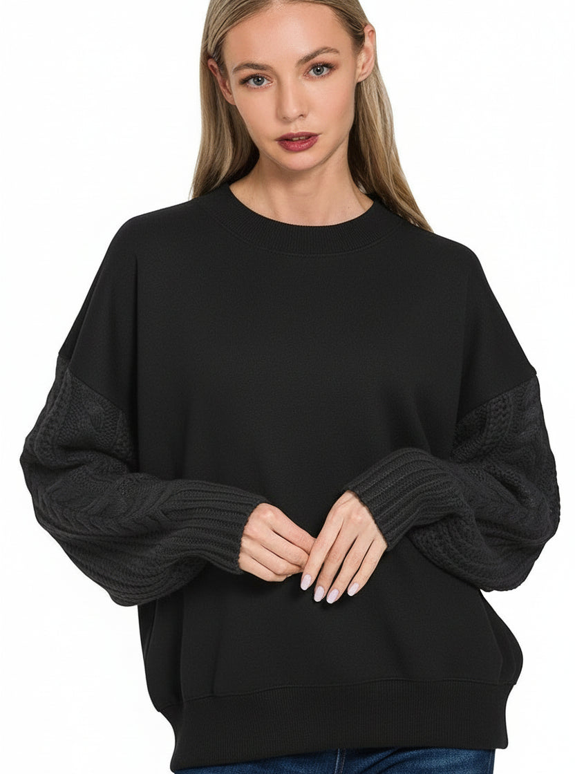 Woman wearing a black sweater on a white background