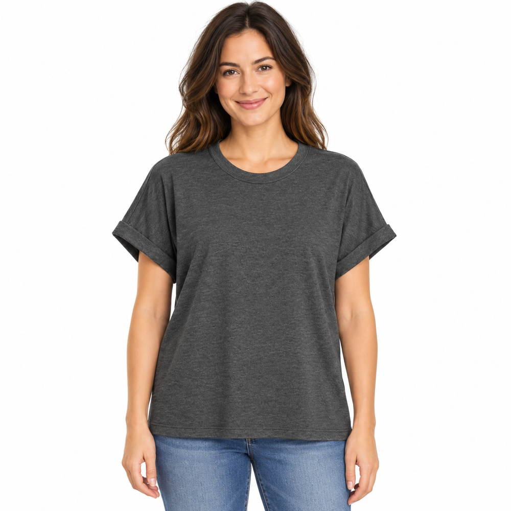 A woman wearing a dark heather gray short-sleeve t-shirt with rolled cuffs and blue jeans, standing against a plain white background.
