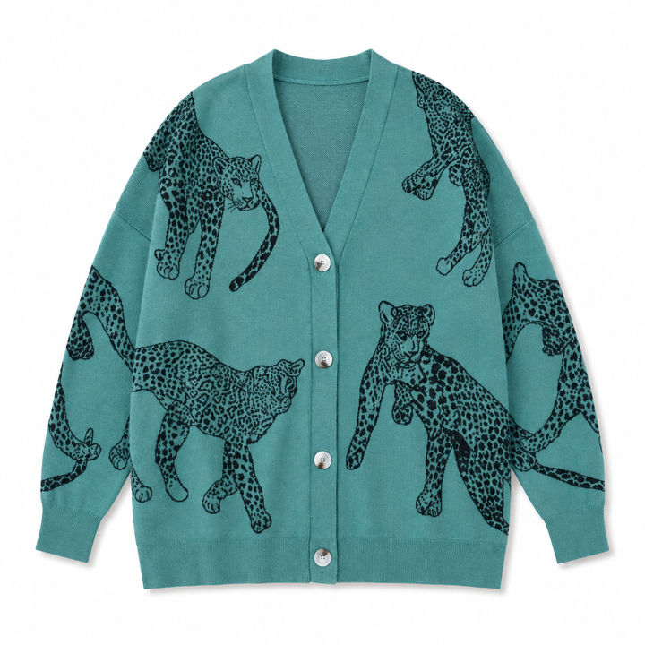 A teal cardigan sweater featuring a black and gray spotted leopard print pattern, displayed flat against a solid white background.
