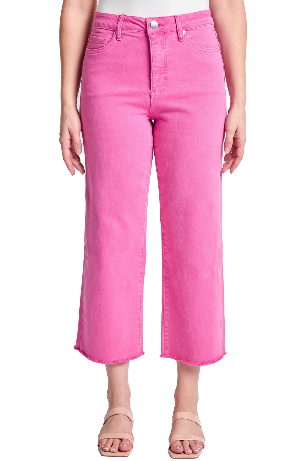 Person wearing bright pink jeans on a white background