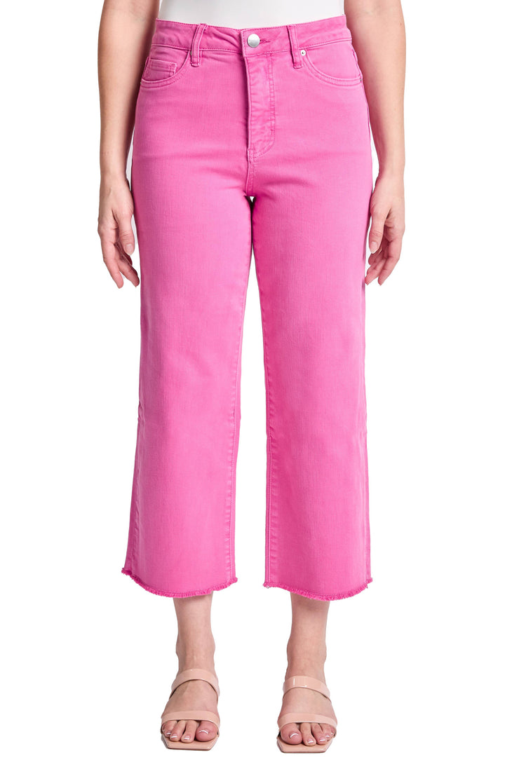 Person wearing bright pink jeans on a white background