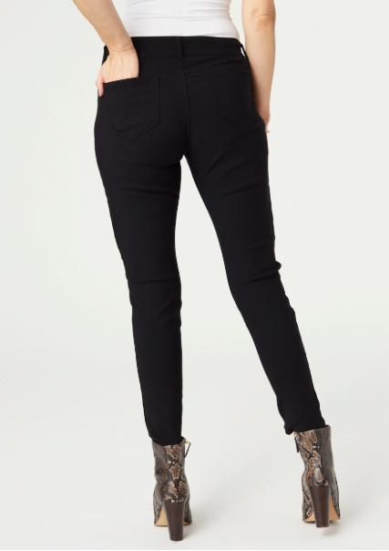 Person wearing black pants on a white background