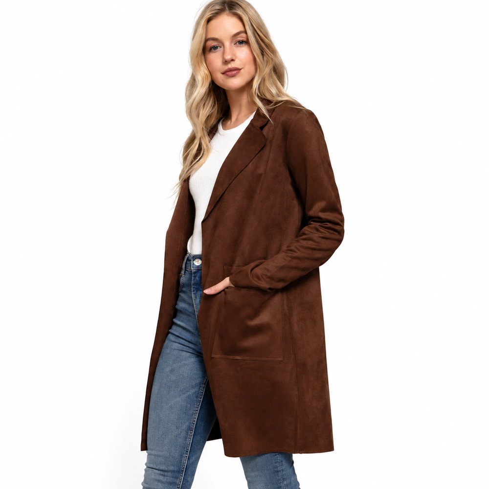 A woman modeling a brown suede-like open-front coat over a white top and blue jeans, photographed against a plain white studio background.