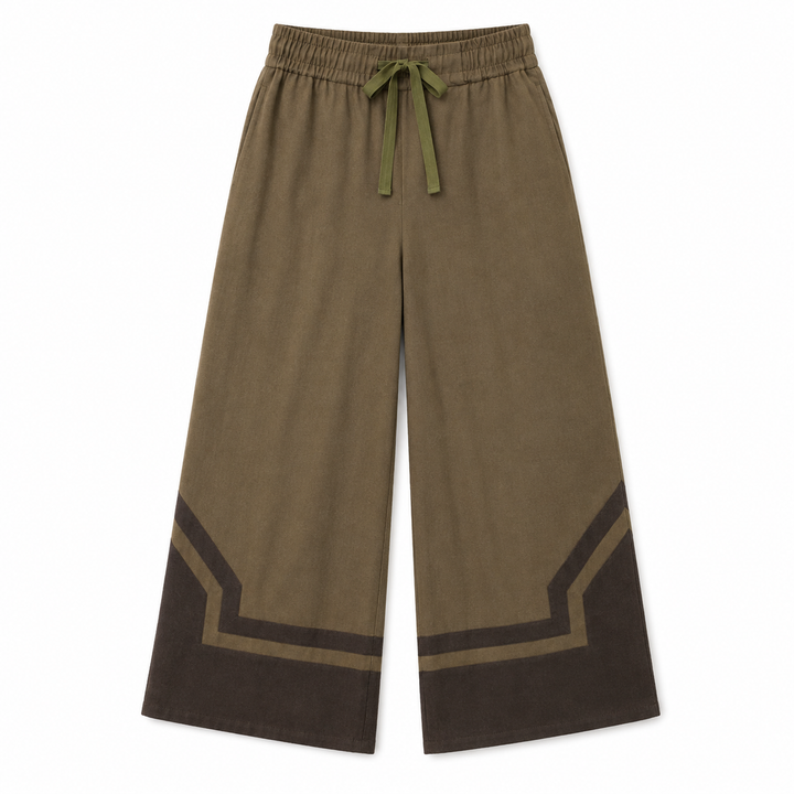 A pair of wide-leg pants in olive brown with a matching olive drawstring and dark brown geometric contrast panels at the lower hems, shown flat on a white background.