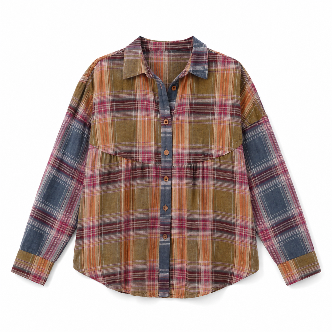 A long-sleeve plaid button-up shirt with a unique design featuring a mustard yellow and orange plaid body, a blue-gray plaid chest panel, and blue-gray plaid sleeves. The shirt is displayed flat against a solid white background.