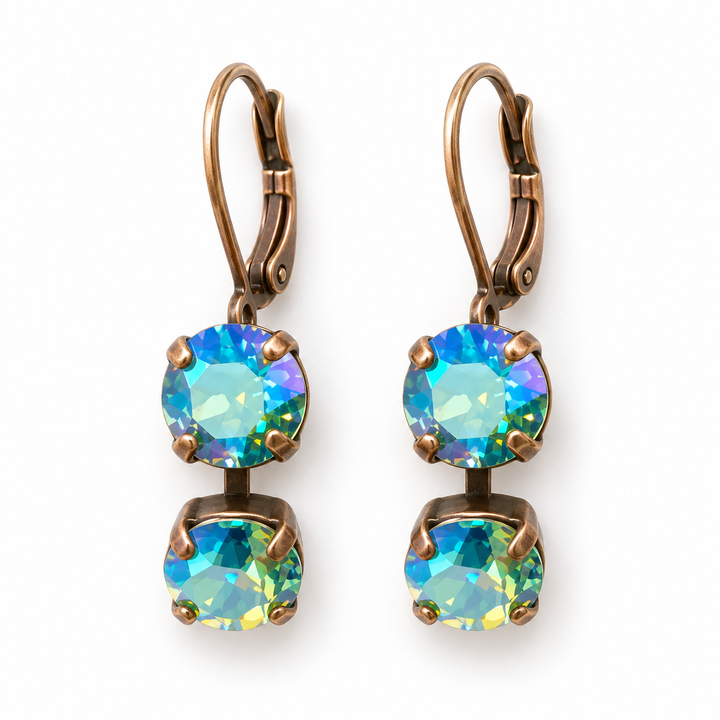 A pair of drop earrings with round iridescent blue-green opal-like stones in a bronze-toned setting, suspended from matching leverback hooks on a plain white background.