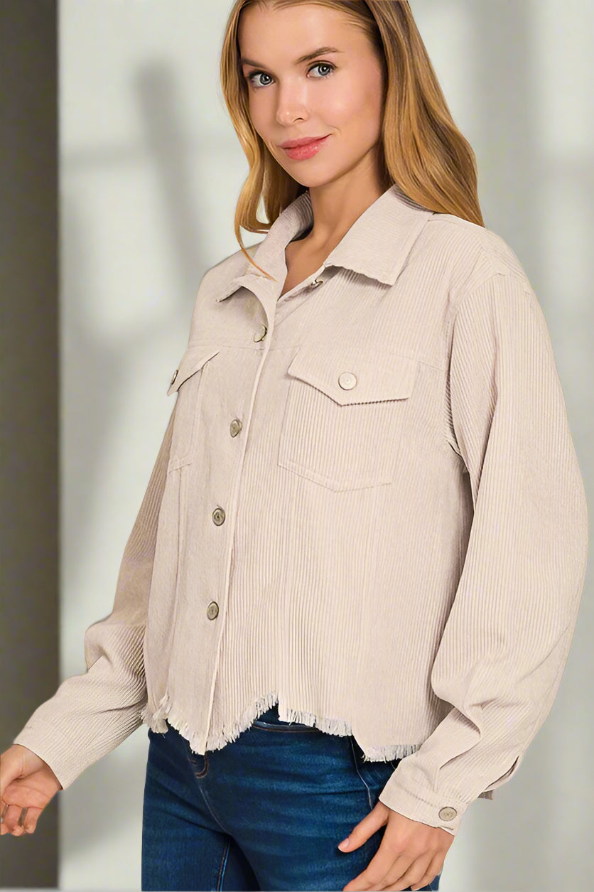 Woman wearing a sand beige corduroy jacket on a white background