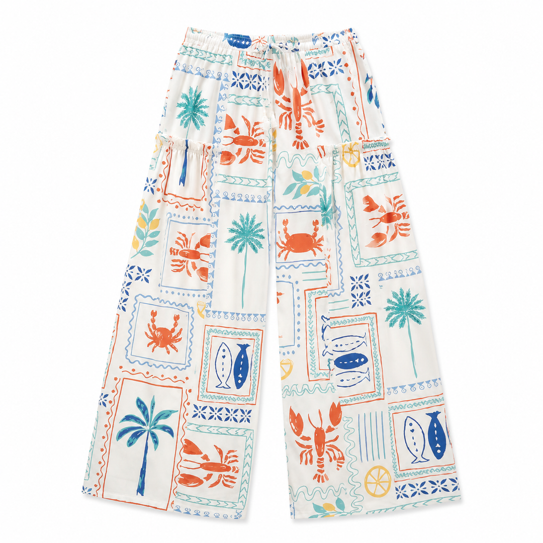 Colorful patterned pants with sea-themed designs on a white background