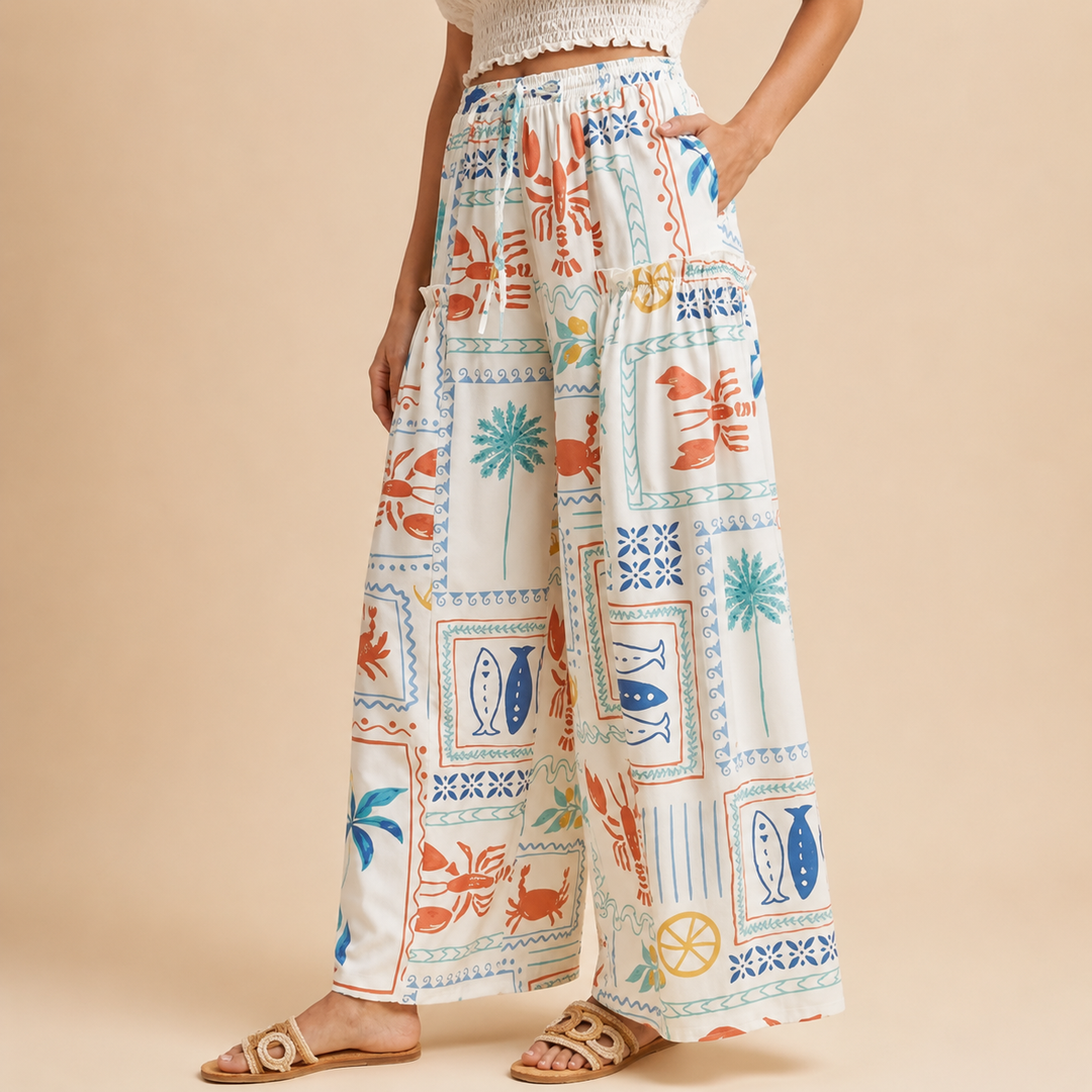 Colorful patterned pants worn by a person on a beige background