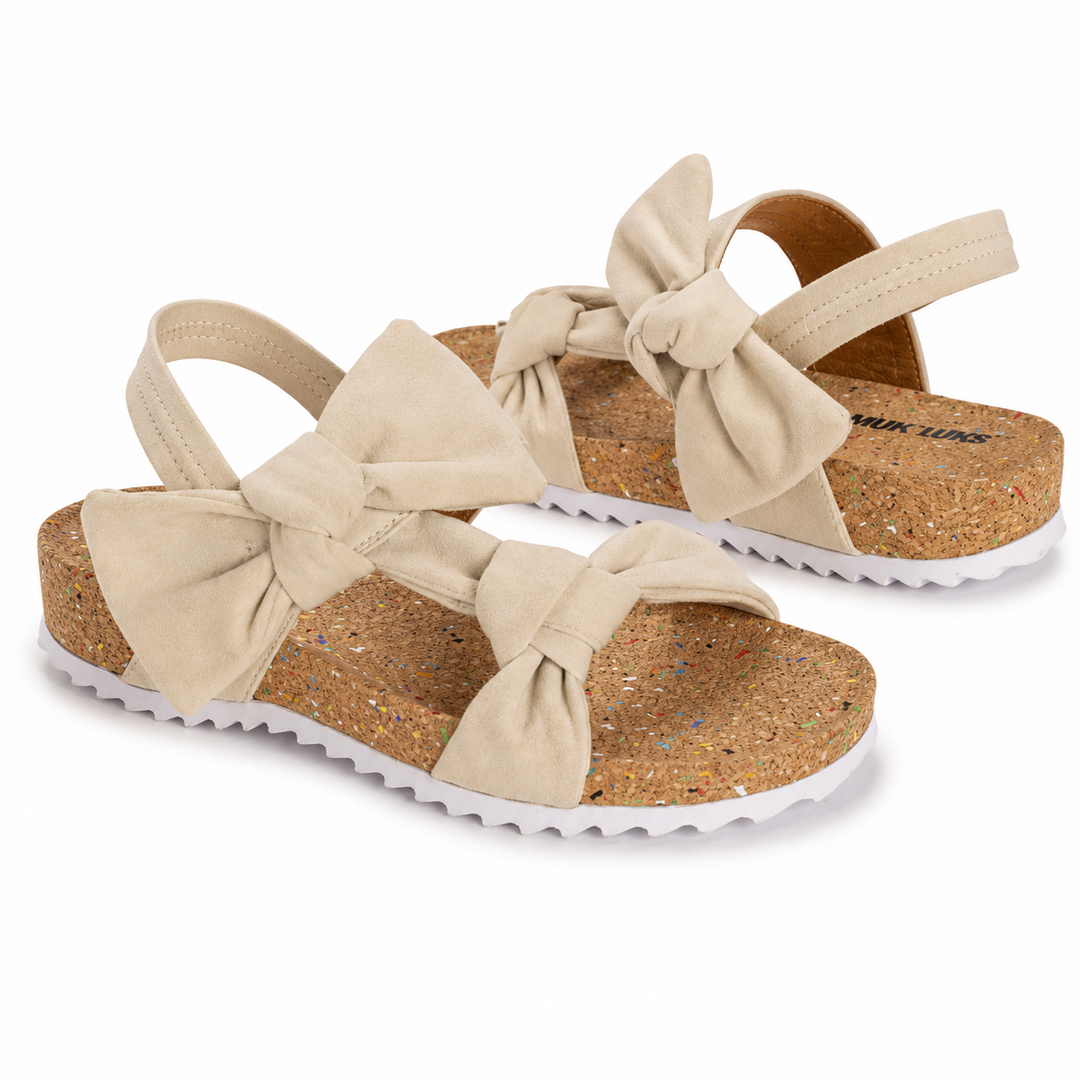 Beige sandals with bow details on a white background