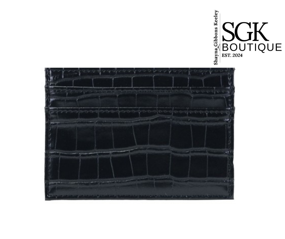 Black crocodile-patterned wallet on a white background with &