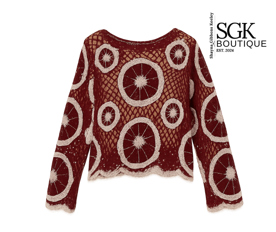 Red sweater with circular patterns on a white background, featuring SGK Boutique logo.