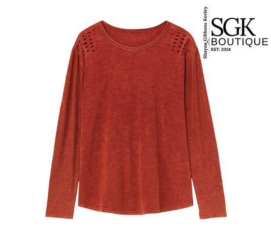 Red long-sleeve top with cut-out shoulders on a white background, featuring SGK Boutique logo.