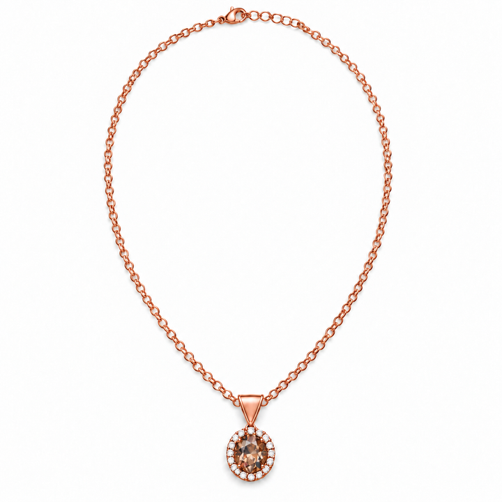 A rose gold chain necklace with a round pendant featuring a brown gemstone surrounded by small clear stones, displayed on a clean white background.
