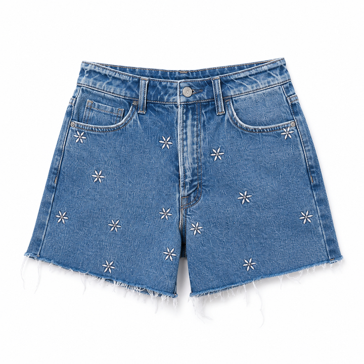 Blue denim shorts with star patterns on a white background