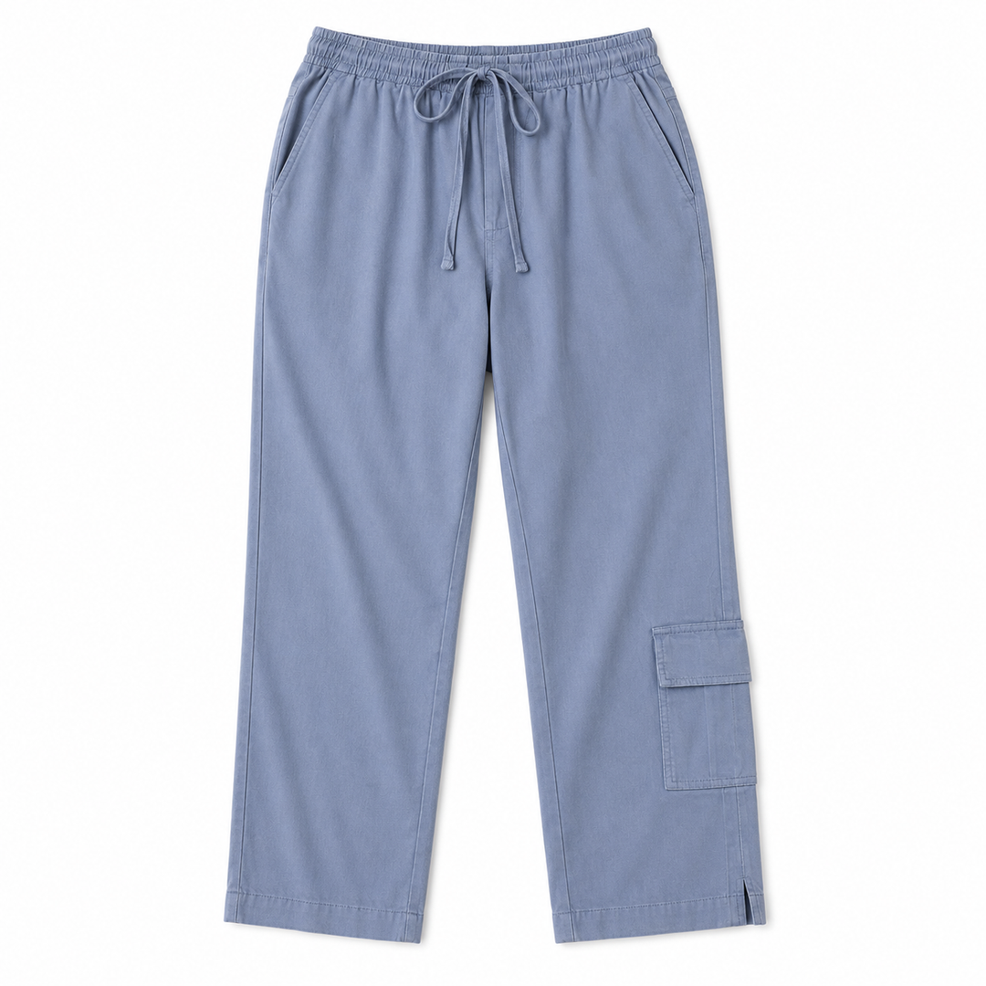 Light blue scrub pants with an elastic waistband, drawstring, and cargo pocket on one leg, shown flat on a white background.