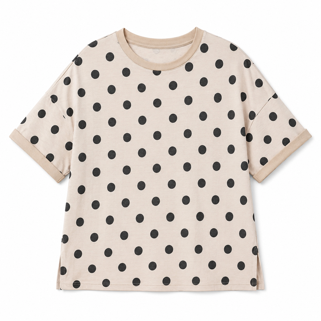 Beige t-shirt with black polka dot pattern on a white background
