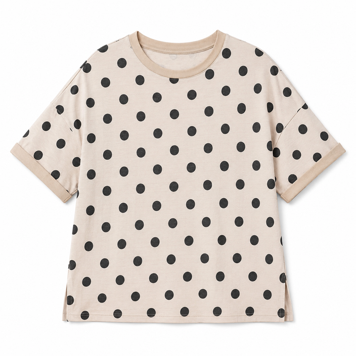 Beige t-shirt with black polka dot pattern on a white background