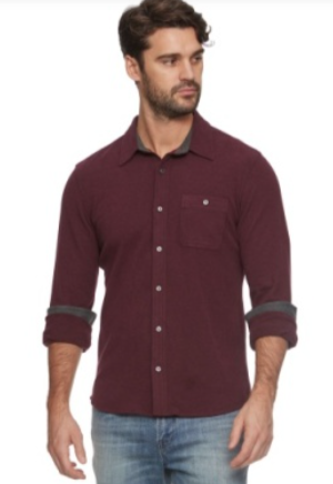 Man wearing a burgundy button-up shirt with rolled-up sleeves on a white background