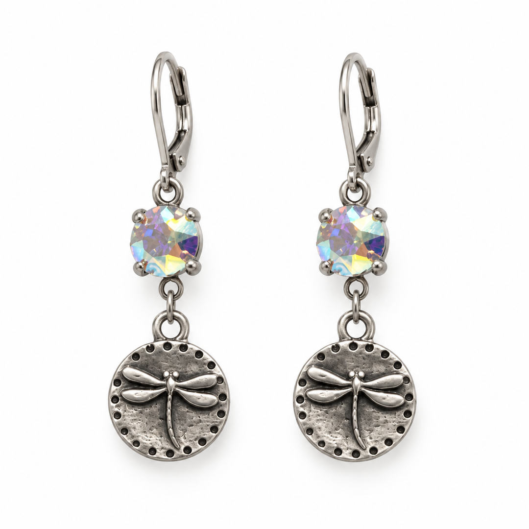 A pair of silver-toned drop earrings featuring a round iridescent opal gemstone and an oval textured dragonfly charm, shown on a plain white background.