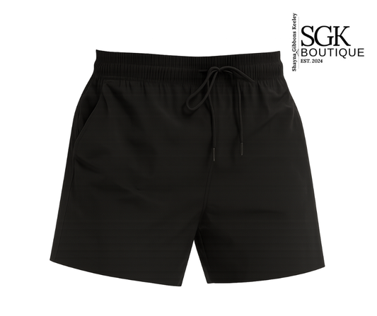 Black shorts with drawstring on a white background, featuring the SGK Boutique logo.