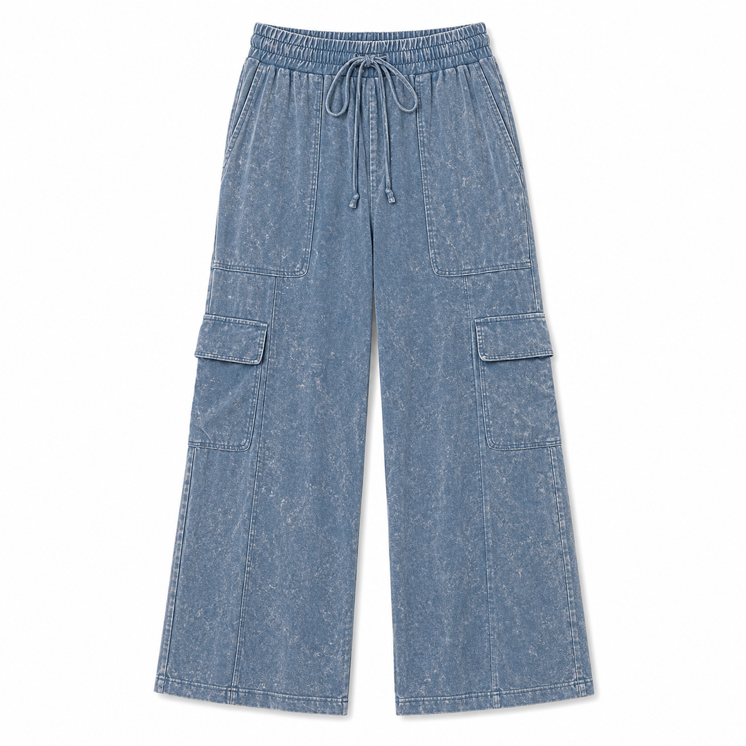 Blue denim cargo pants on a white background
