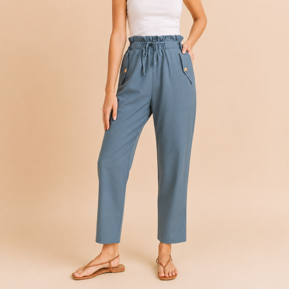 Person wearing blue pants on a beige background