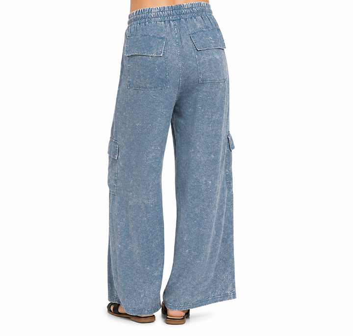 Blue denim cargo pants on a white background