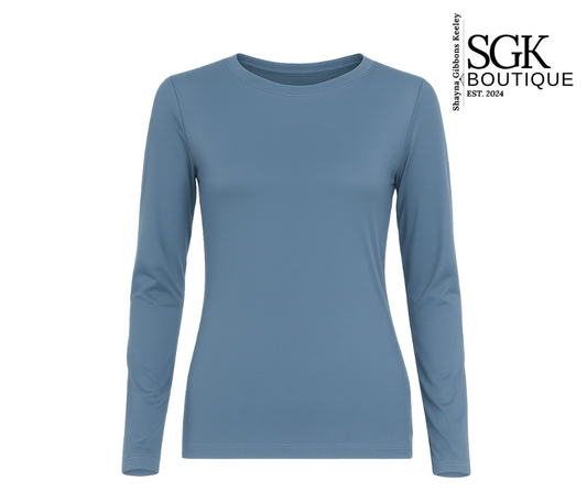 Blue long-sleeve shirt on a white background with SGK Boutique logo.