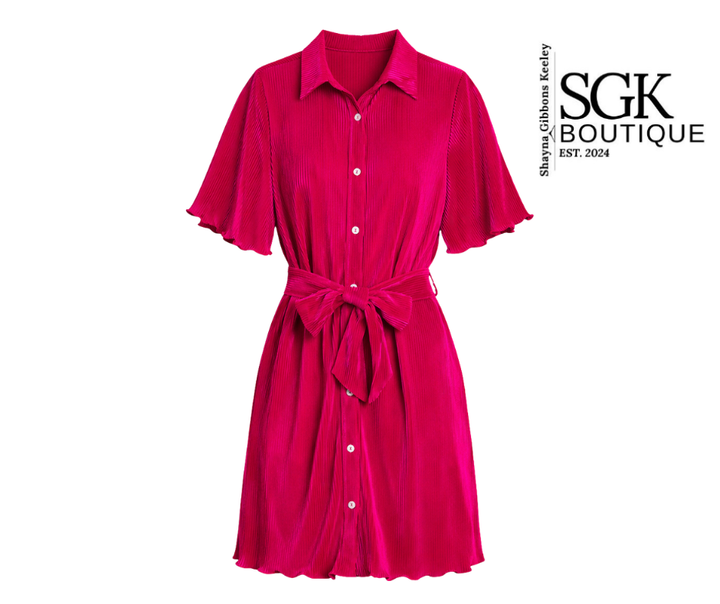 Pink dress with a belt on a white background, featuring the SGK Boutique logo.