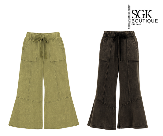 Two pairs of wide-leg pants, one green and one green, on a white background with SGK Boutique logo.