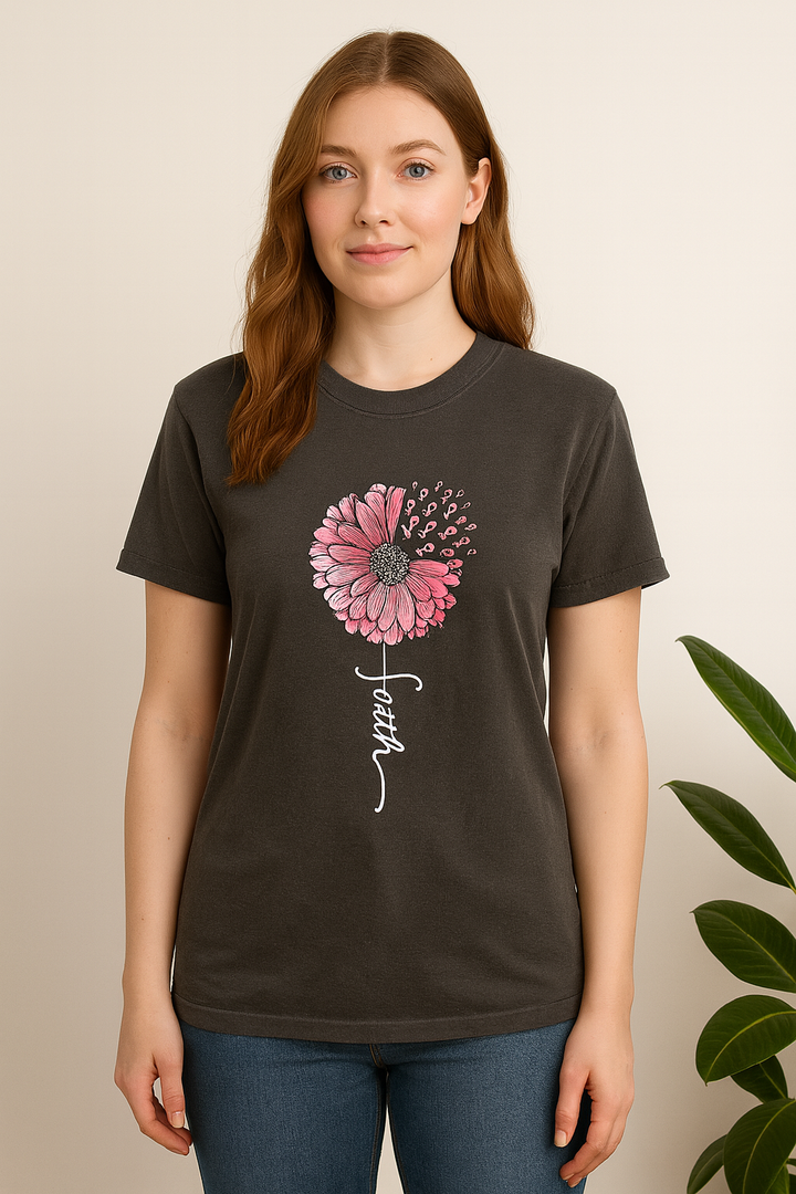 Person wearing a dark gray t-shirt with a pink flower and &