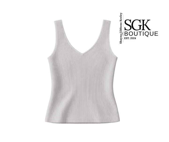 White ribbed tank top on a white background with SGK Boutique branding.