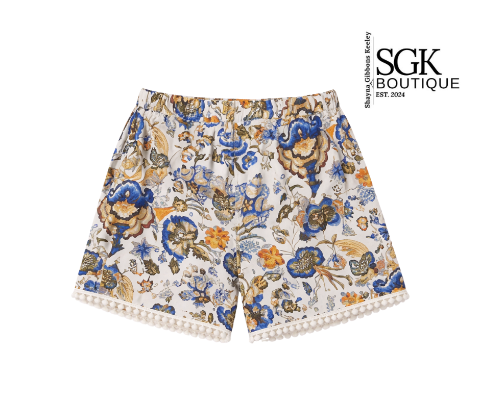 Floral shorts with colorful patterns on a white background, featuring the SGK Boutique logo.