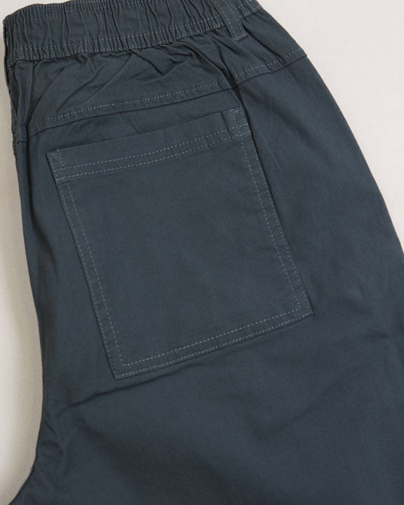 Navy shorts with a pocket on a light beige background