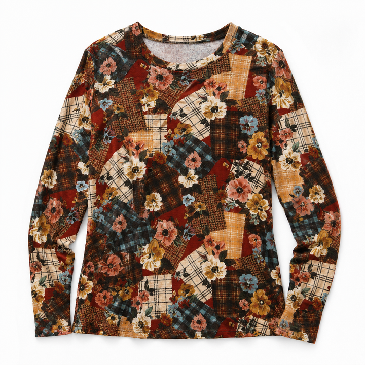 A long-sleeve crewneck top featuring an intricate patchwork print with floral and plaid patterns in earthy tones of brown, beige, red, blue, and yellow, displayed flat against a white background.