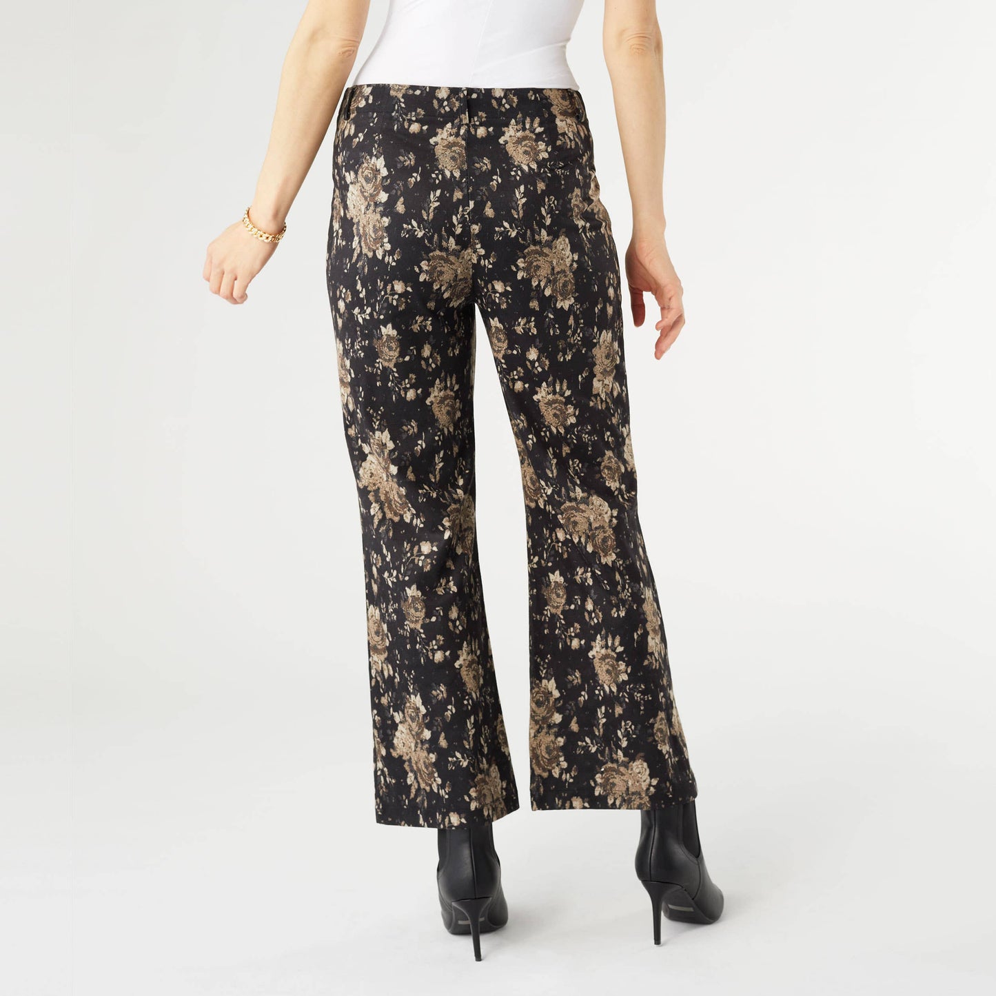 Floral-patterned pants worn by a person on a white background