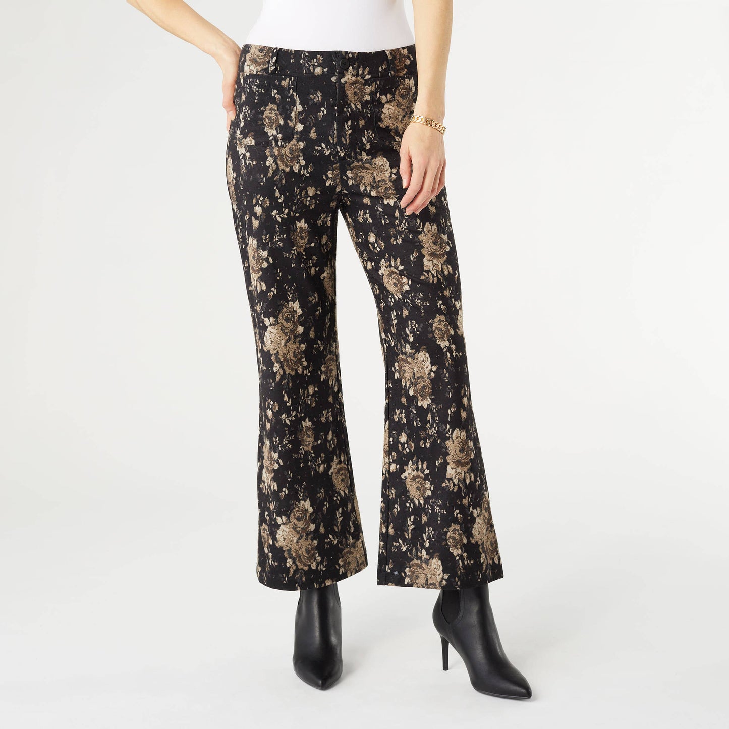 Floral-patterned pants worn by a person on a white background