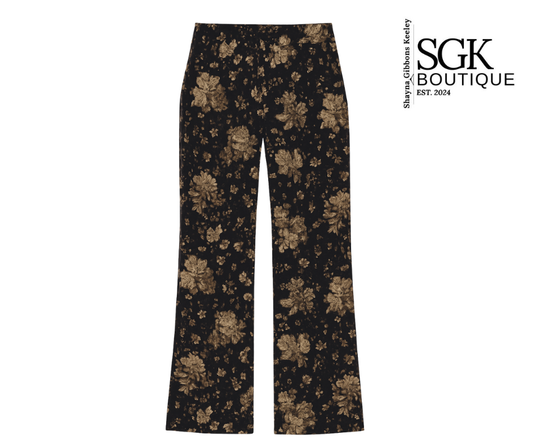 Floral-patterned pants on a white background with SGK Boutique logo.
